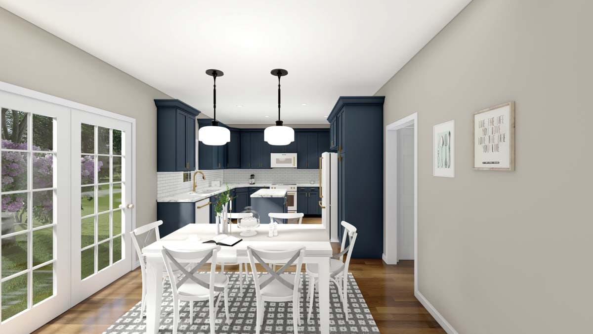 Interior view of a kitchen and dining area with navy cabinetry, white chairs, and french doors leading outdoors.