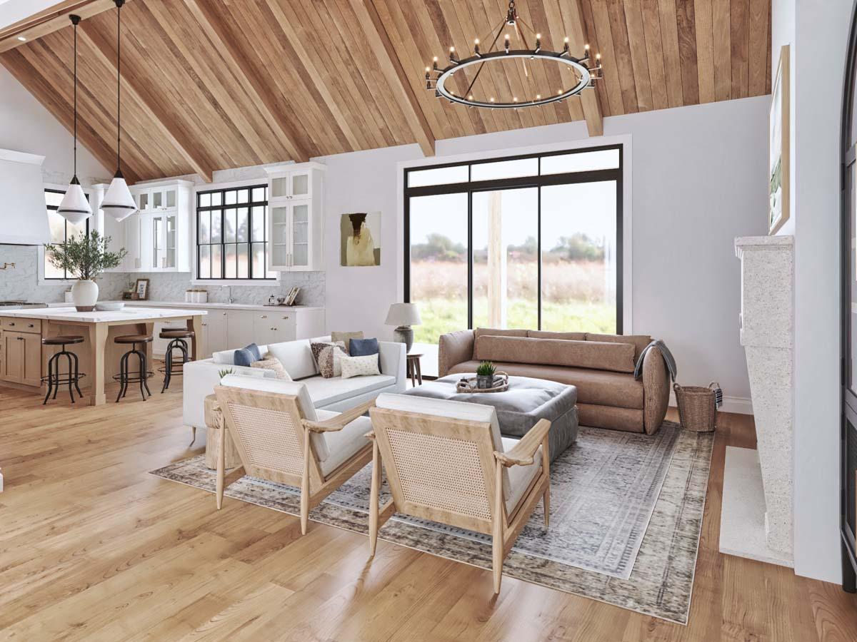 Open concept living and kitchen area with vaulted wood plank ceiling, island, large windows, and stone fireplace.