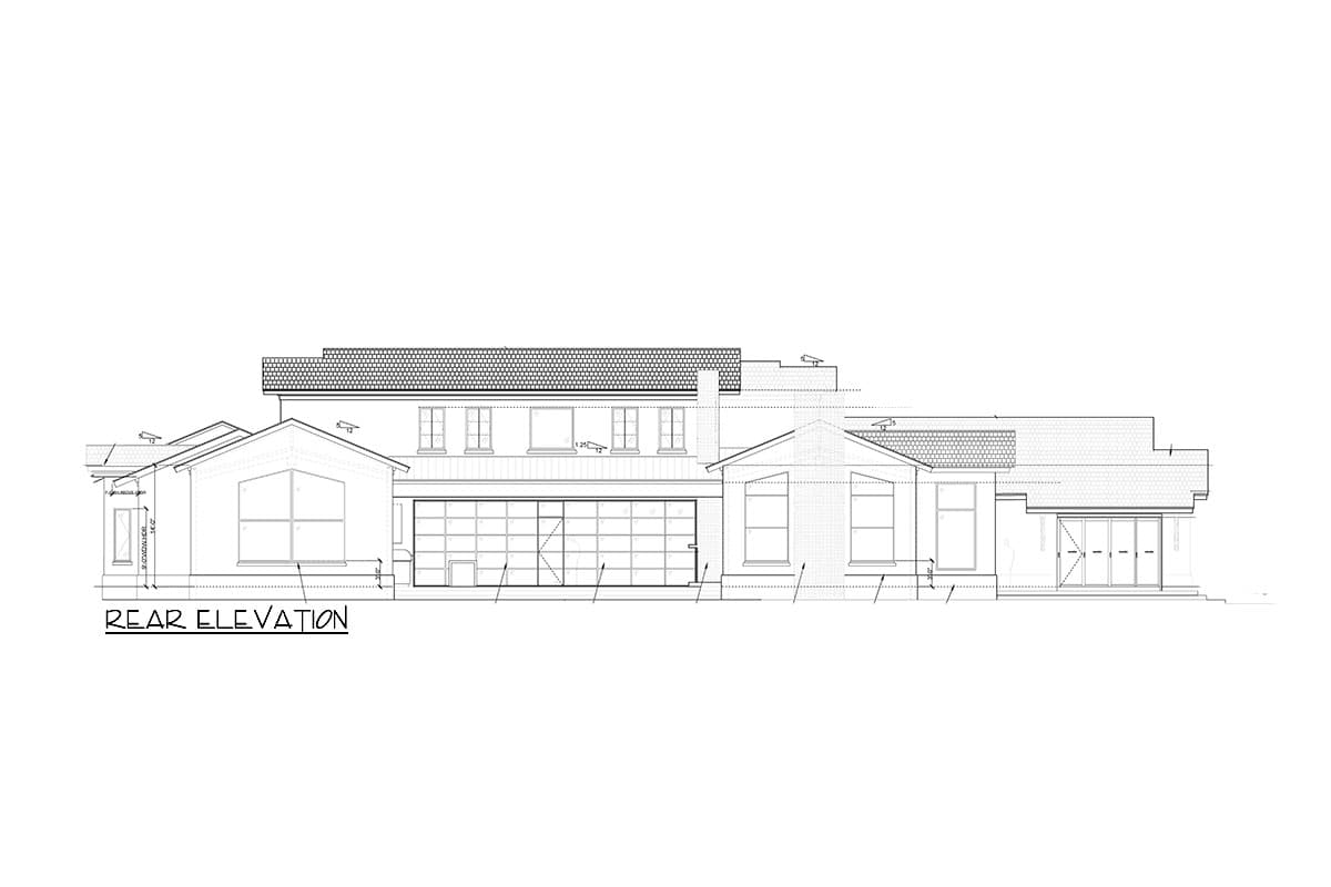Rear elevation drawing of a two-story house with a large glass garage door, multiple gables, and various window types.