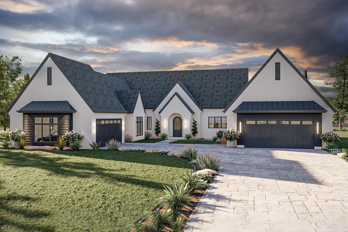 House plan exterior featuring a two-story design with a gabled roof, garage, and arched entry door. Exterior includes a stone paver driveway.