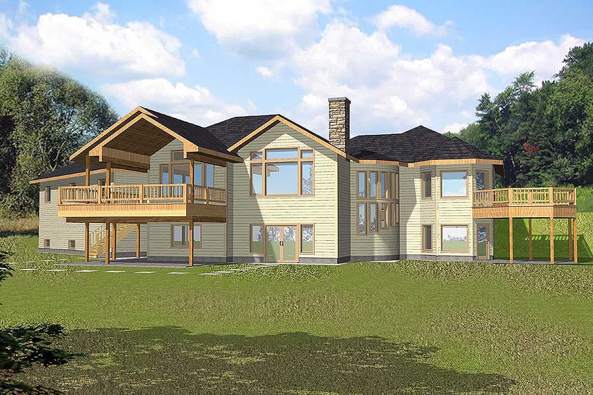 House plan exterior: Two-story home with wood siding, prominent stone chimney, large windows, and multiple decks.