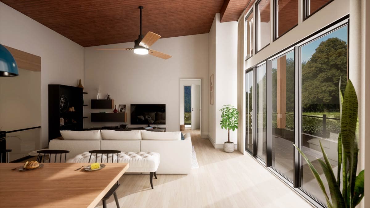 Modern living room with a large white sectional sofa, black shelving, and floor-to-ceiling glass doors showcasing a green outdoor view.