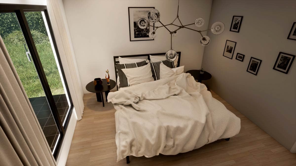 Modern bedroom with a bed, small tables, artwork, and a large window looking onto greenery. A stylish light fixture hangs above.