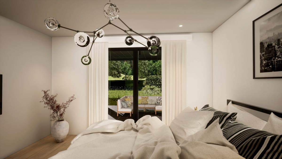 A bedroom features a modern chandelier, bed with white bedding, and a sliding glass door leading to an outdoor patio with furniture.