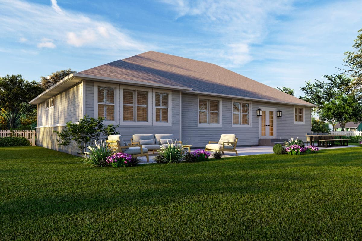 Ranch style house plan exterior, one story, showing siding, multiple windows, and double doors leading to patio.