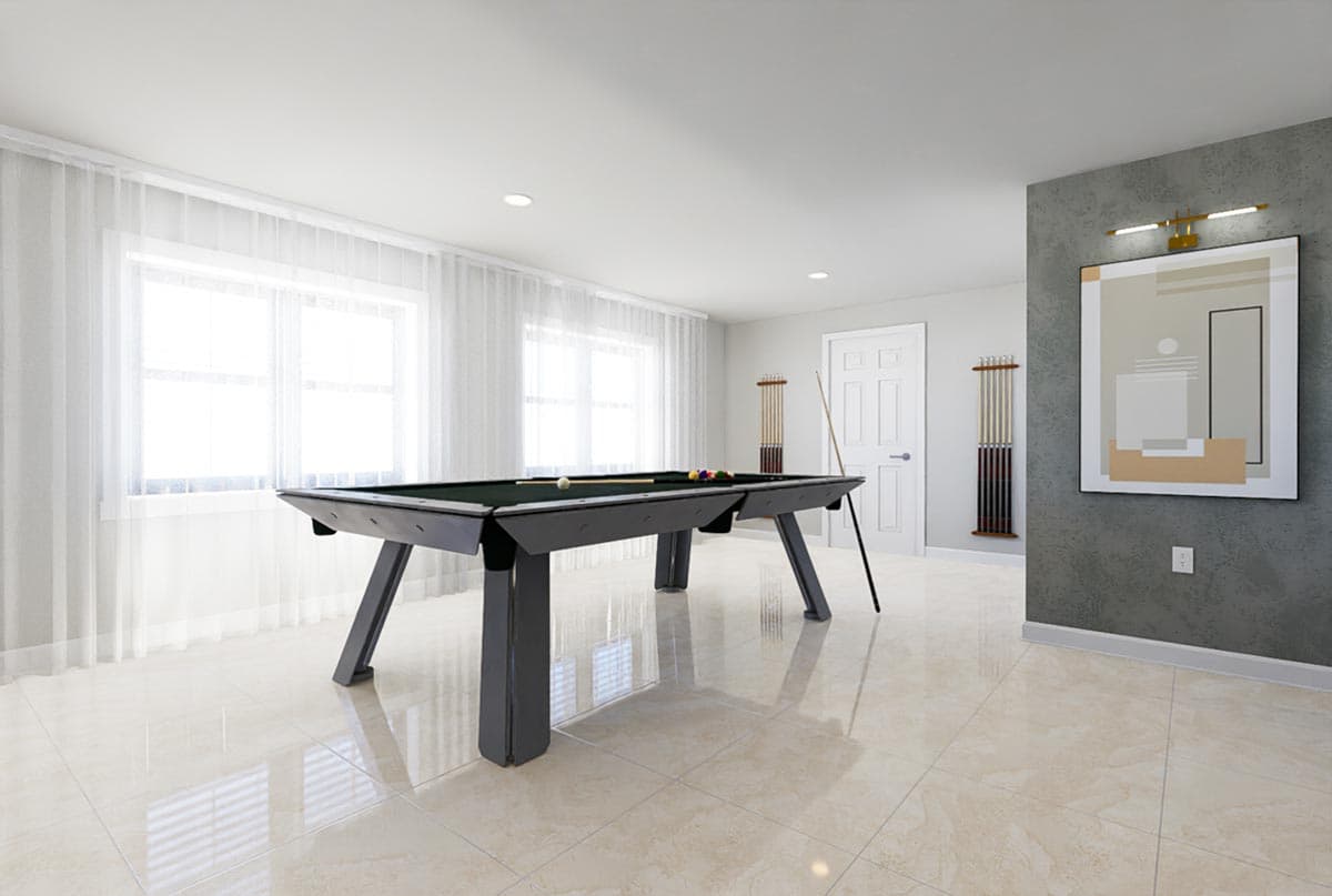 Recreation room with pool table, windows with sheer curtains, and abstract art on textured wall.