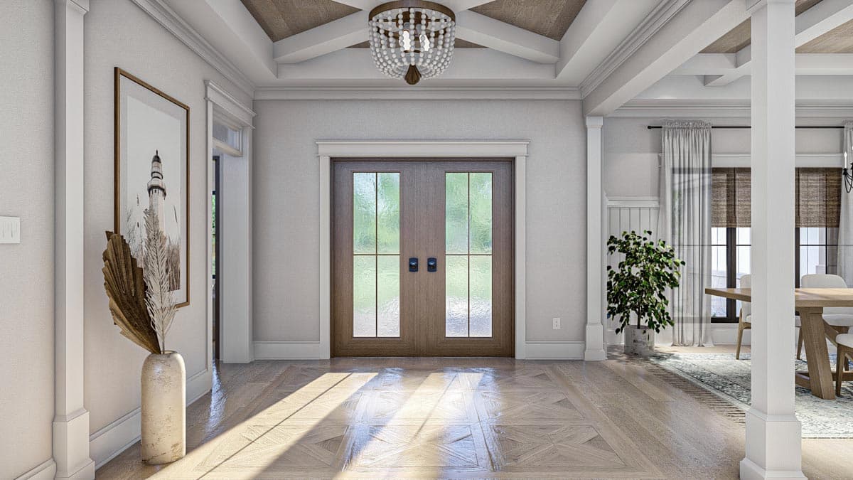 Interior view of an entryway with double doors, coffered wood ceiling, and parquet wood flooring.