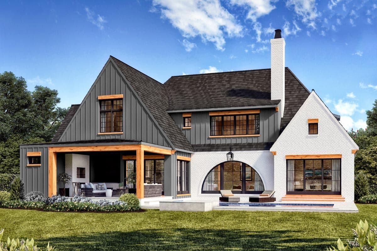 House plan exterior: Modern Farmhouse style, two stories, with gables, metal siding, white brick, and a covered porch with fireplace.