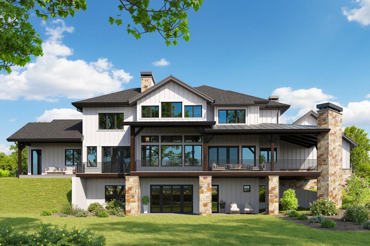 House plan exterior rendering of a modern farmhouse style home with a walkout basement, stone accents, and covered decks.