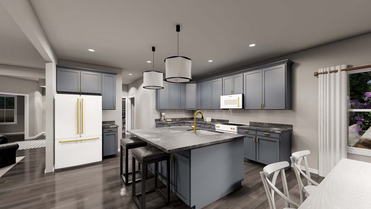 Kitchen with gray cabinets, large island with sink, white refrigerator with gold handles, and pendant lighting.