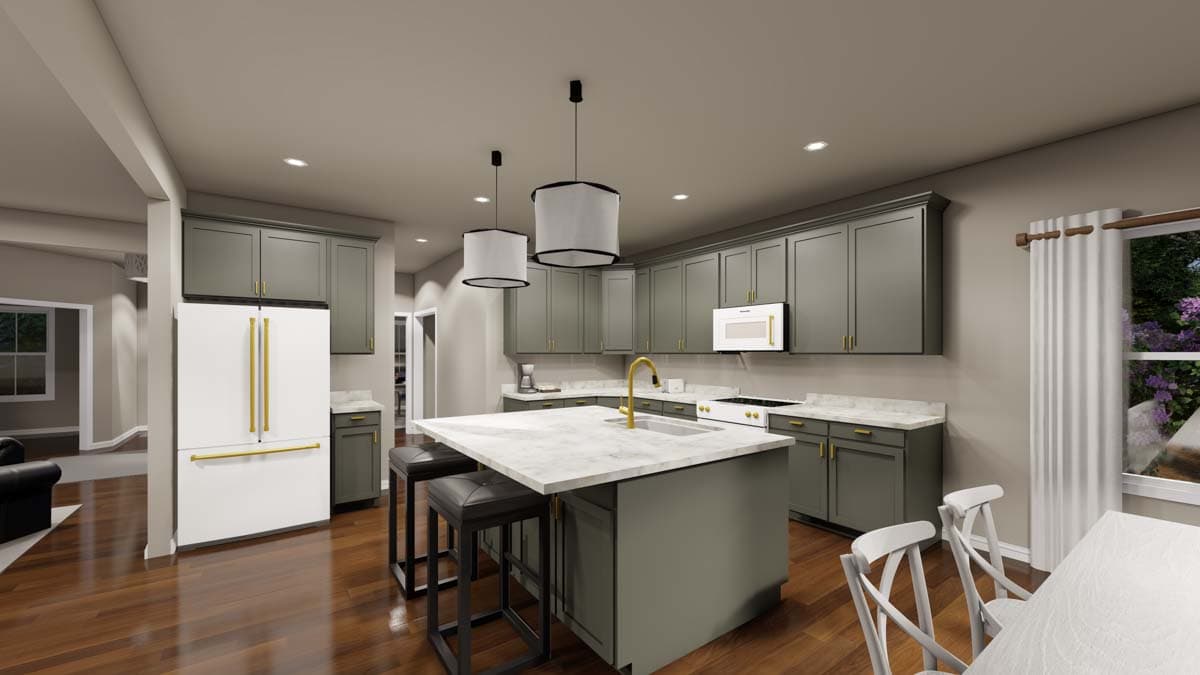 Kitchen with gray cabinets, large island with sink and seating, white refrigerator, and window view.