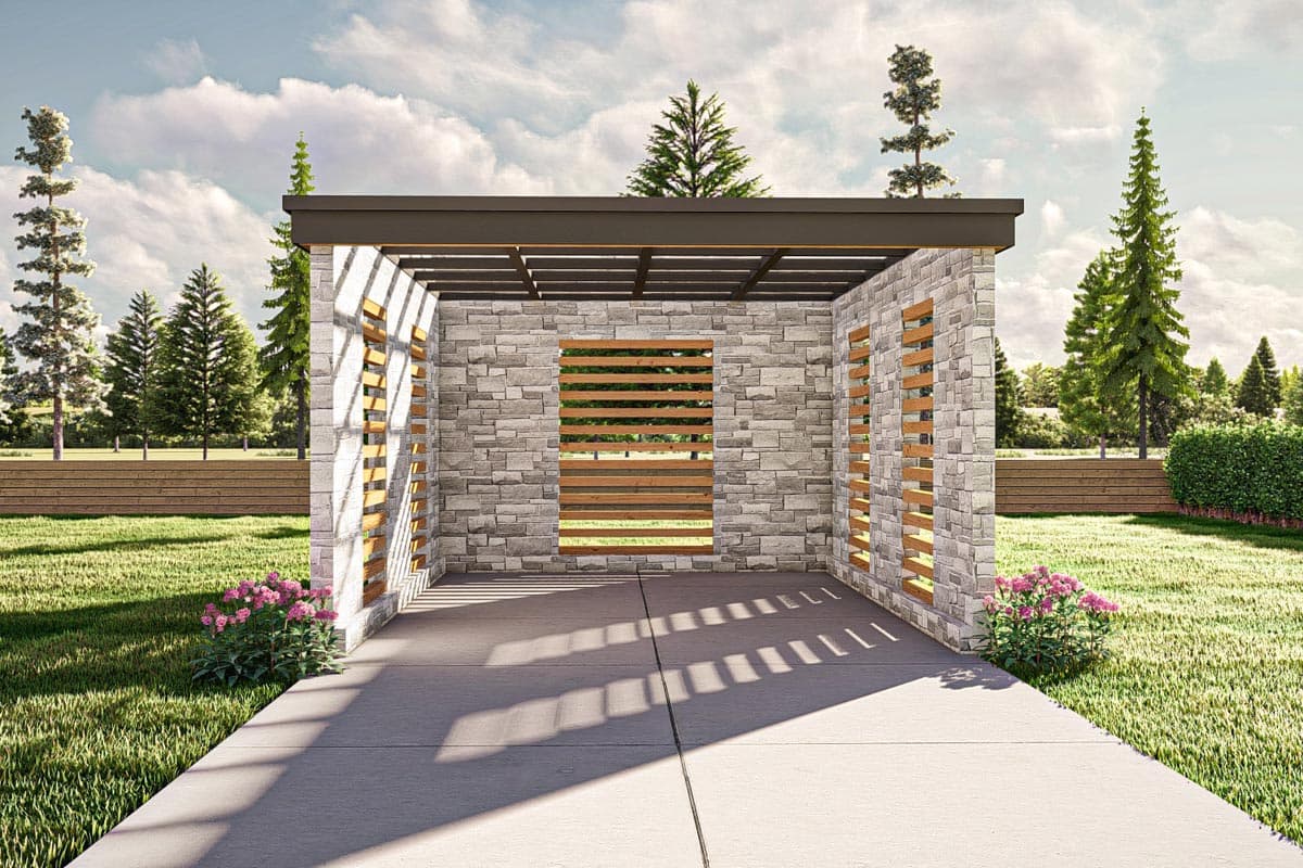 Modern pergola with stone walls, wood slat accents, and a flat roof, set in a grassy yard.