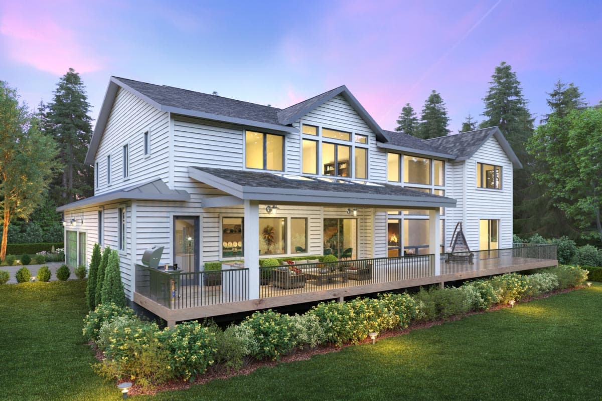 Two-story Modern Farmhouse exterior with horizontal siding, gables, and a wraparound deck with an outdoor fireplace.