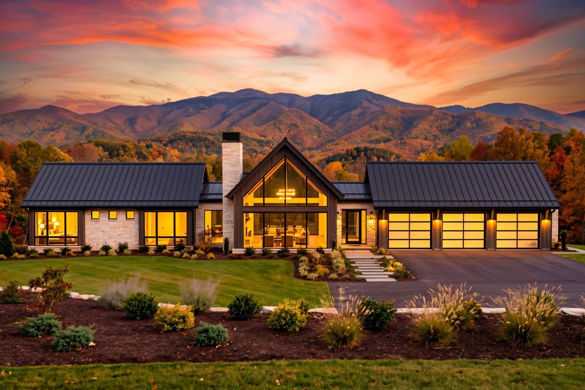 Modern house plan exterior with a metal gable roof, stone facade, large glass windows, and a three-car garage with glass doors.