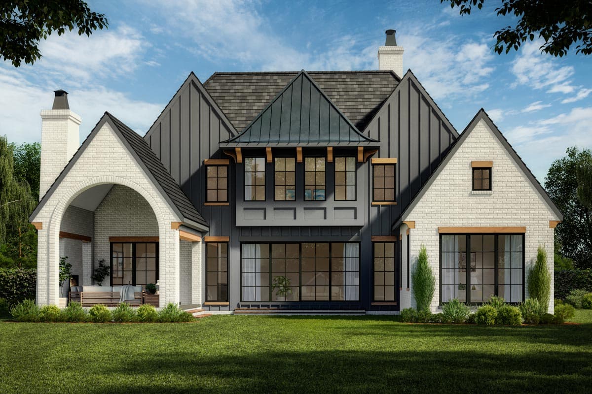 Modern Farmhouse house plan exterior with white brick, dark siding, gables, and arched covered porch.