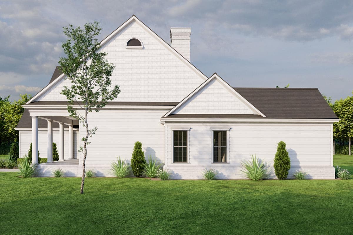 House plan exterior: Two-story Modern Farmhouse with covered porch, gable dormer, and decorative window.