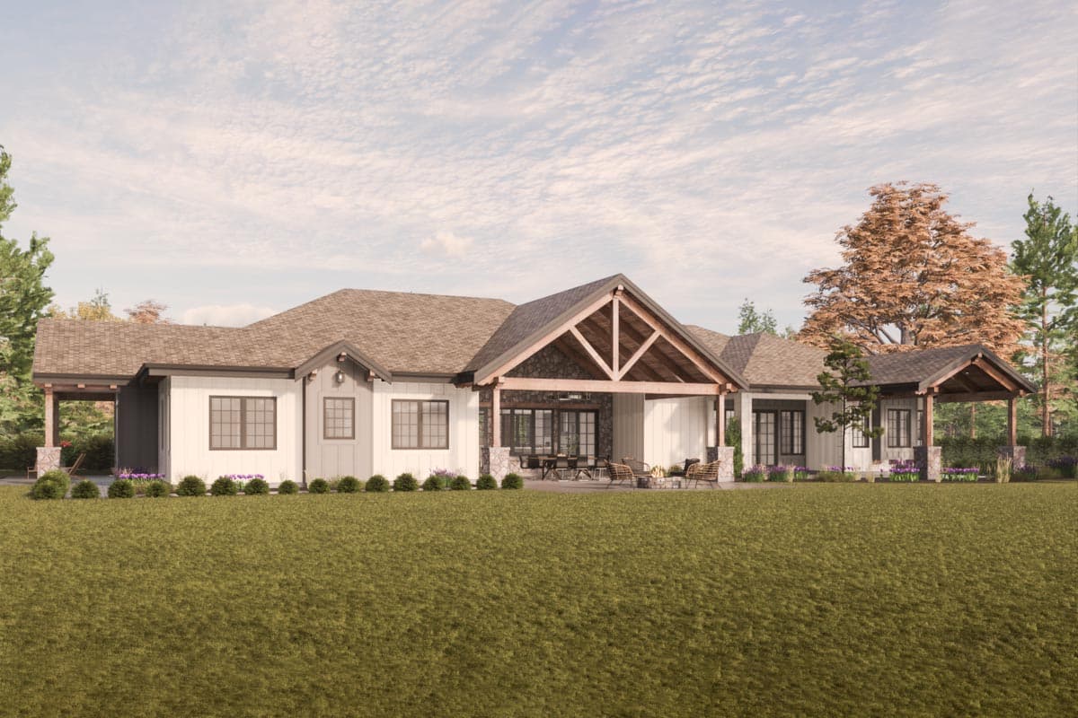 House plan exterior: Ranch style, one story, featuring gabled rooflines, covered patios, and stone accents.