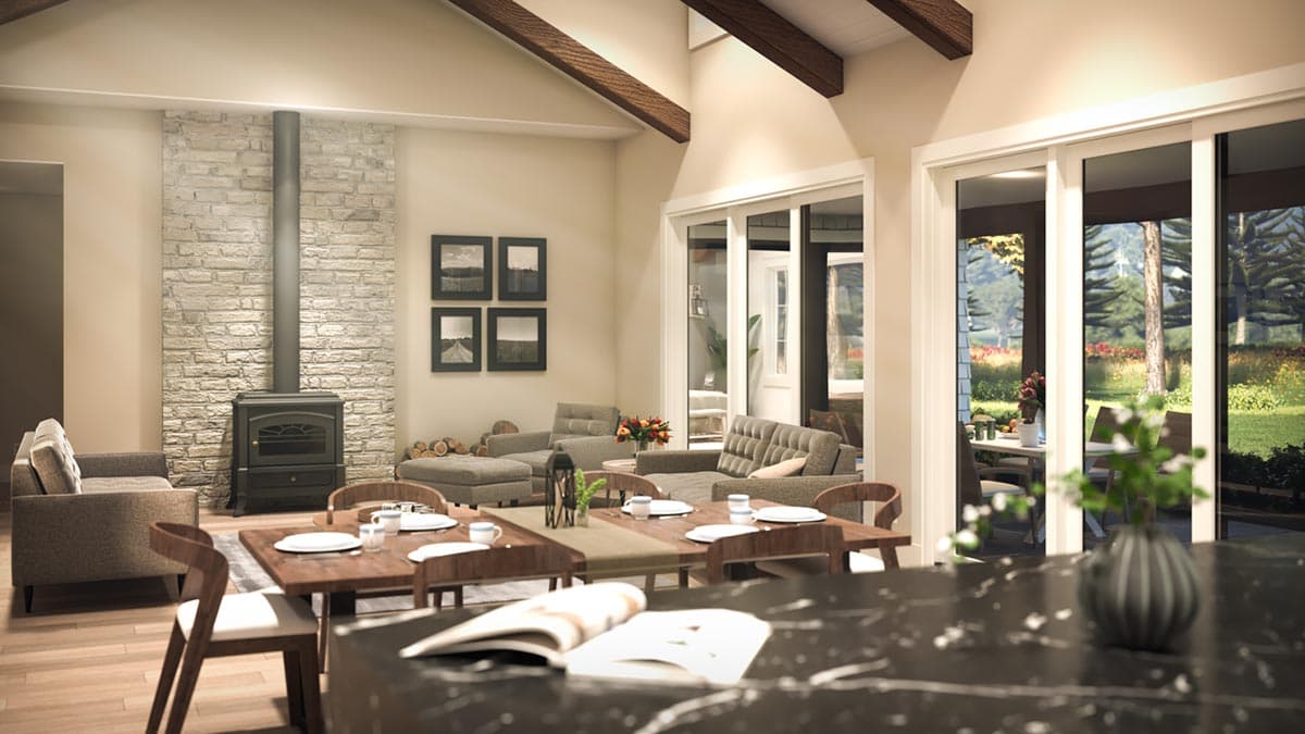 Open concept living and dining area with stone fireplace, vaulted ceiling, wood beams, and large sliding glass doors to backyard.