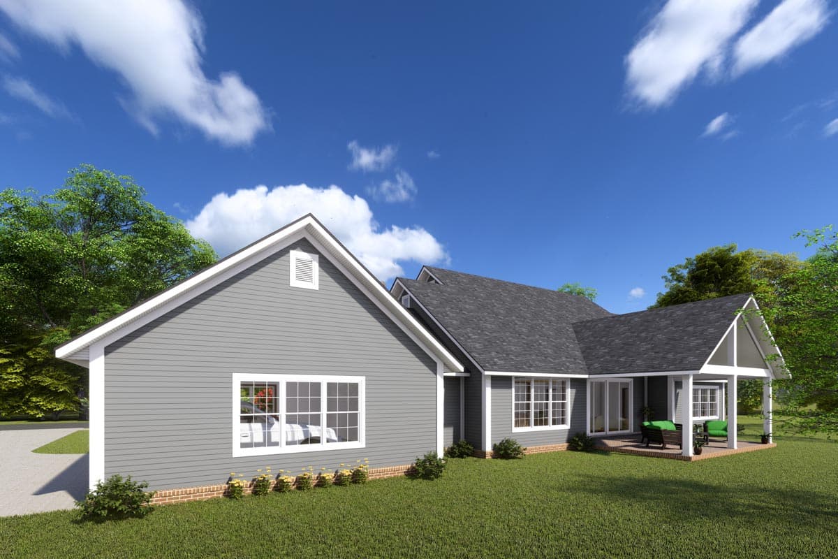 House plan exterior: One-story home with gabled dormers, double-hung windows, and a covered porch with A-frame supports.