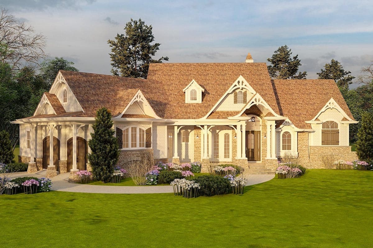 House plan exterior: Tudor style, 1.5 stories, with gabled dormers, stone foundation, and covered entryway with decorative brackets.