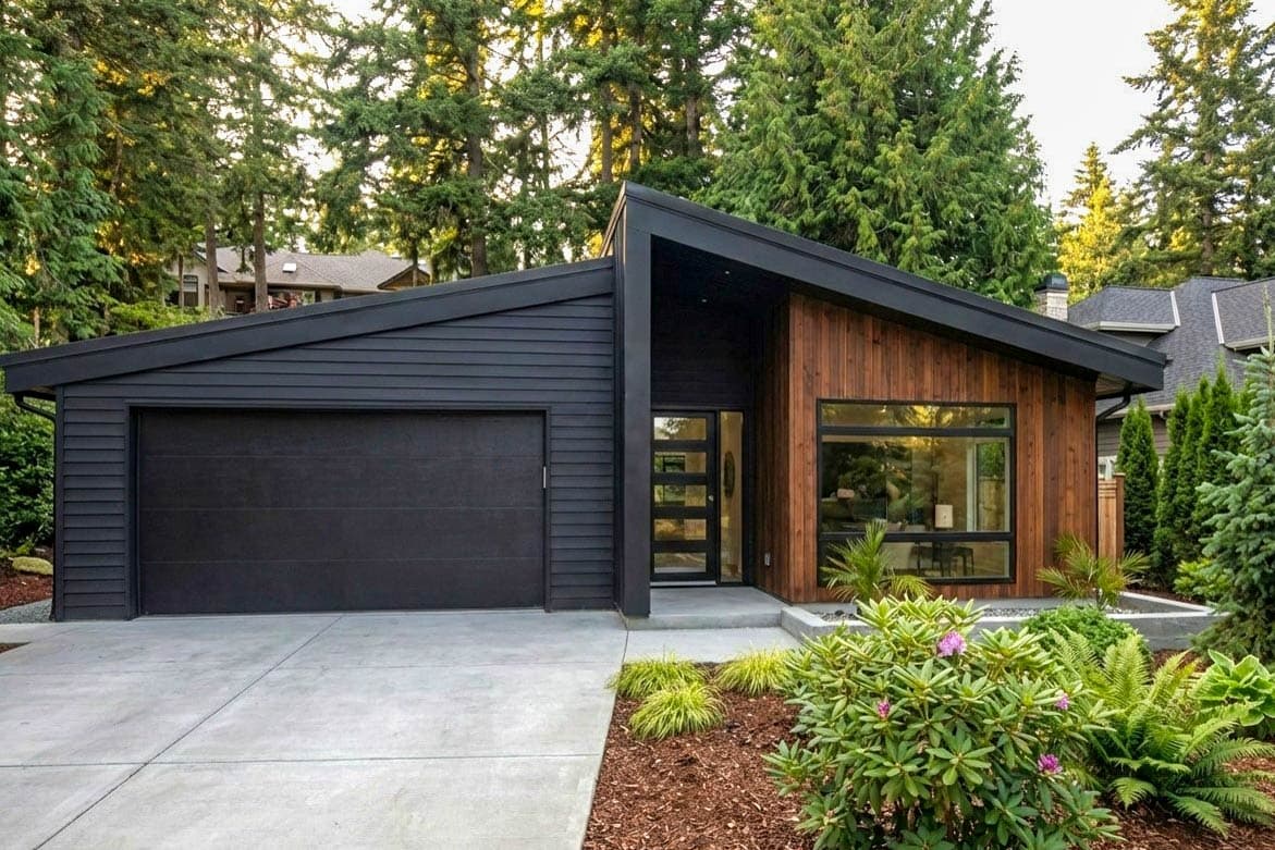 House plan exterior. Modern style with a single-story design. Features include a side-entry garage, wood siding, and a low-slope roofline.