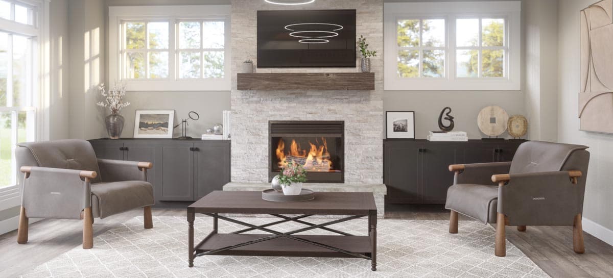 Living room with fireplace, television, two armchairs, coffee table, and large windows.