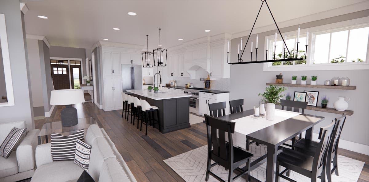 Open concept kitchen and dining area featuring a large island with seating, white cabinetry, and dark dining furniture.