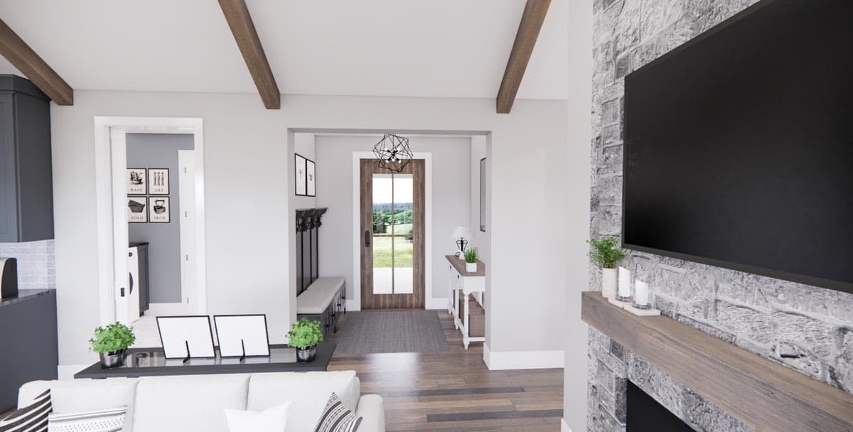Interior rendering showing a living area with a fireplace, television, and entryway with a bench and coat rack.