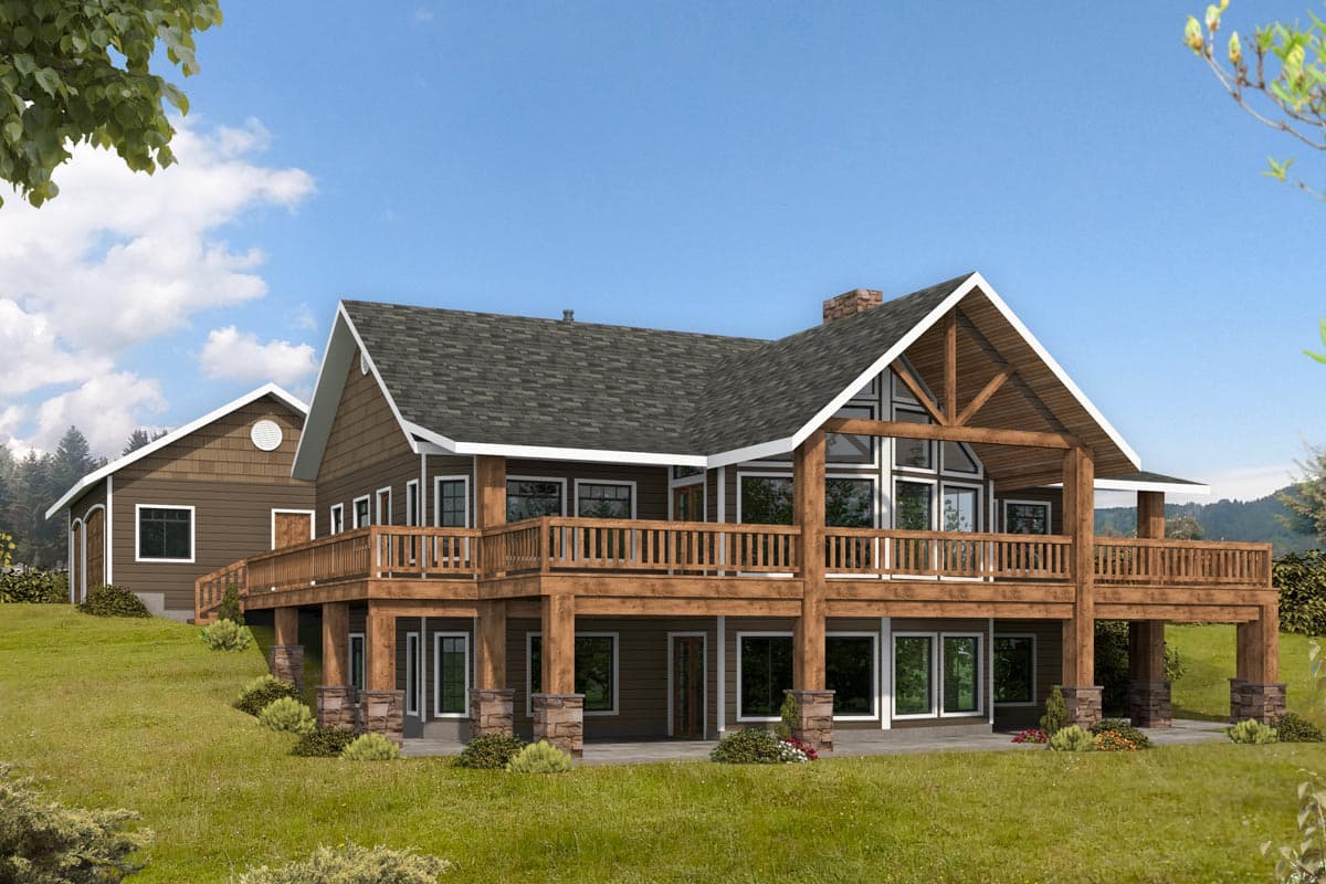 Log cabin house plan exterior with two stories, extensive wooden deck, gable roof, stone chimney, and large windows.
