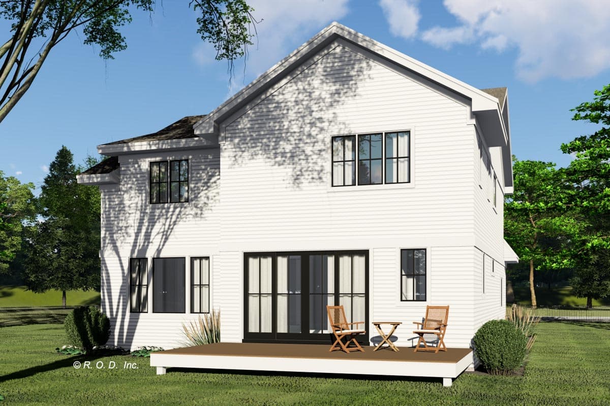 Modern farmhouse exterior of a two-story house plan with a prominent gable, white siding, and large sliding doors to a deck.
