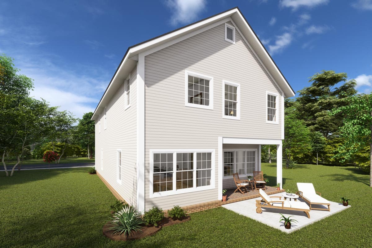 Two-story house plan exterior with gabled roof, vinyl siding, and a covered rear porch with outdoor furniture.