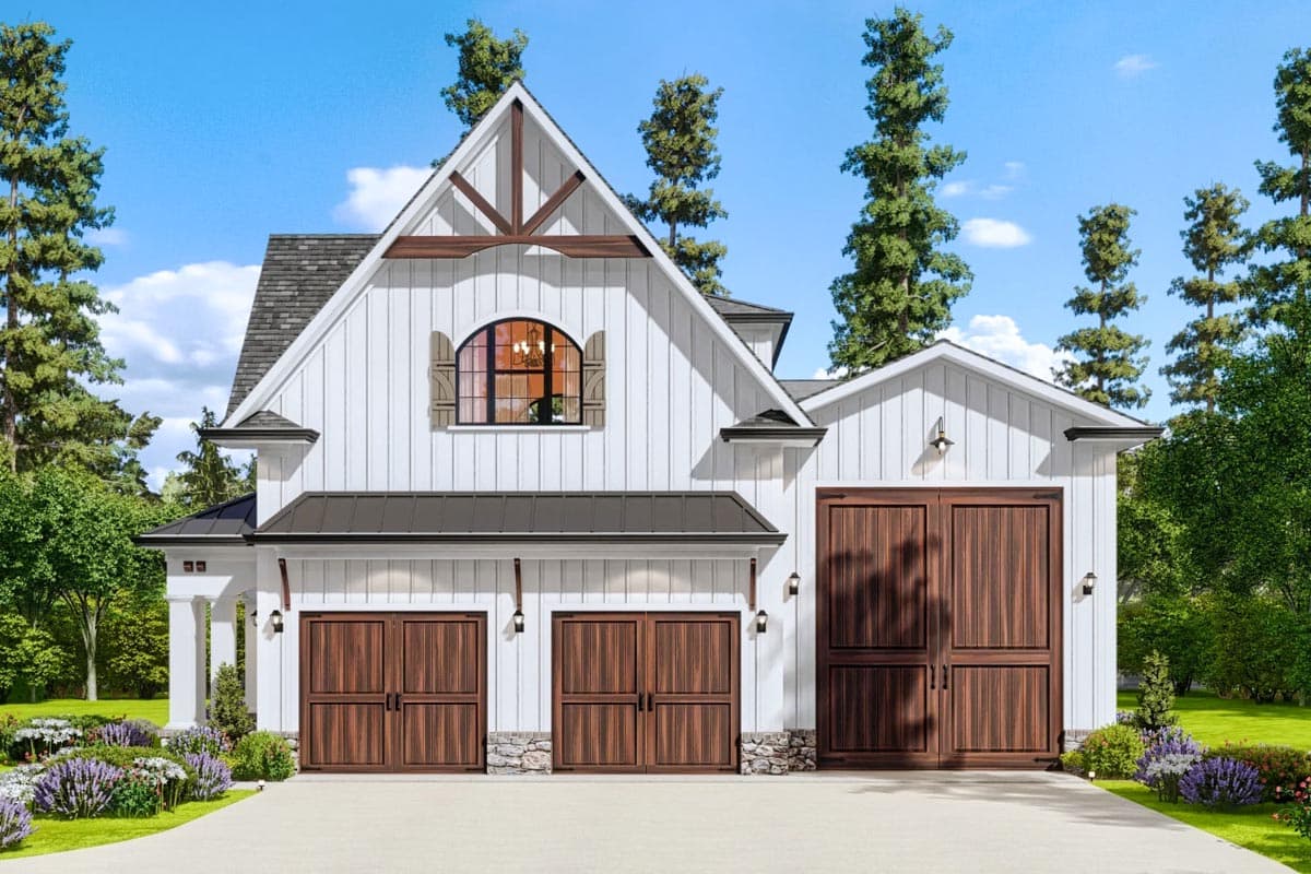 House plan exterior. Two-story Modern Farmhouse with gabled roof, arched window, and garage with carriage-style doors. Stone accents.