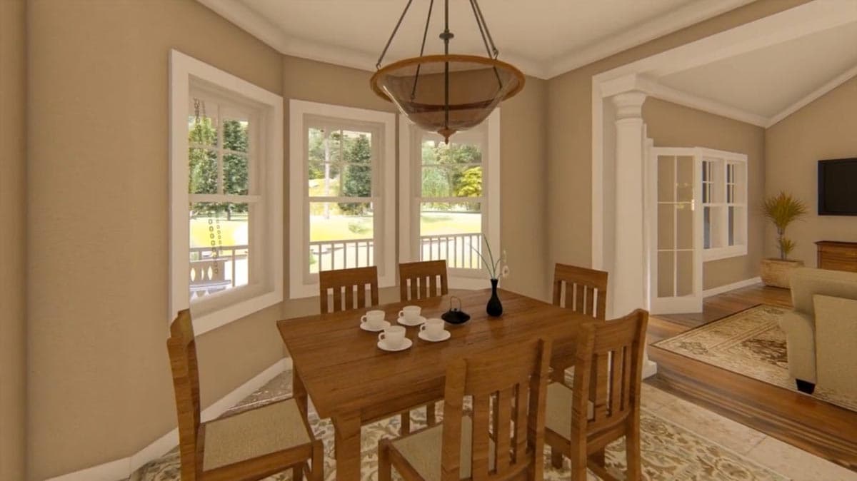 Dining room with wooden table and chairs, bay windows with exterior view, and open doorway to living area.