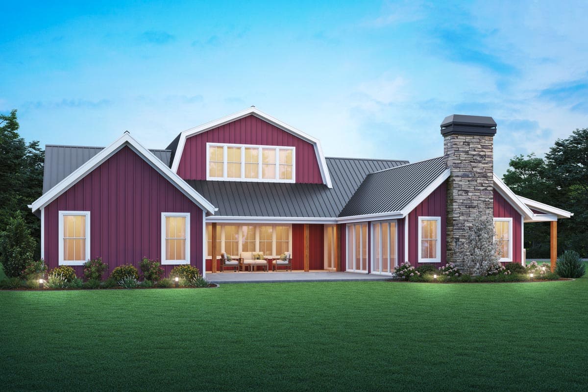 Modern Farmhouse house plan exterior with gambrel roof, stone chimney, and covered patio.