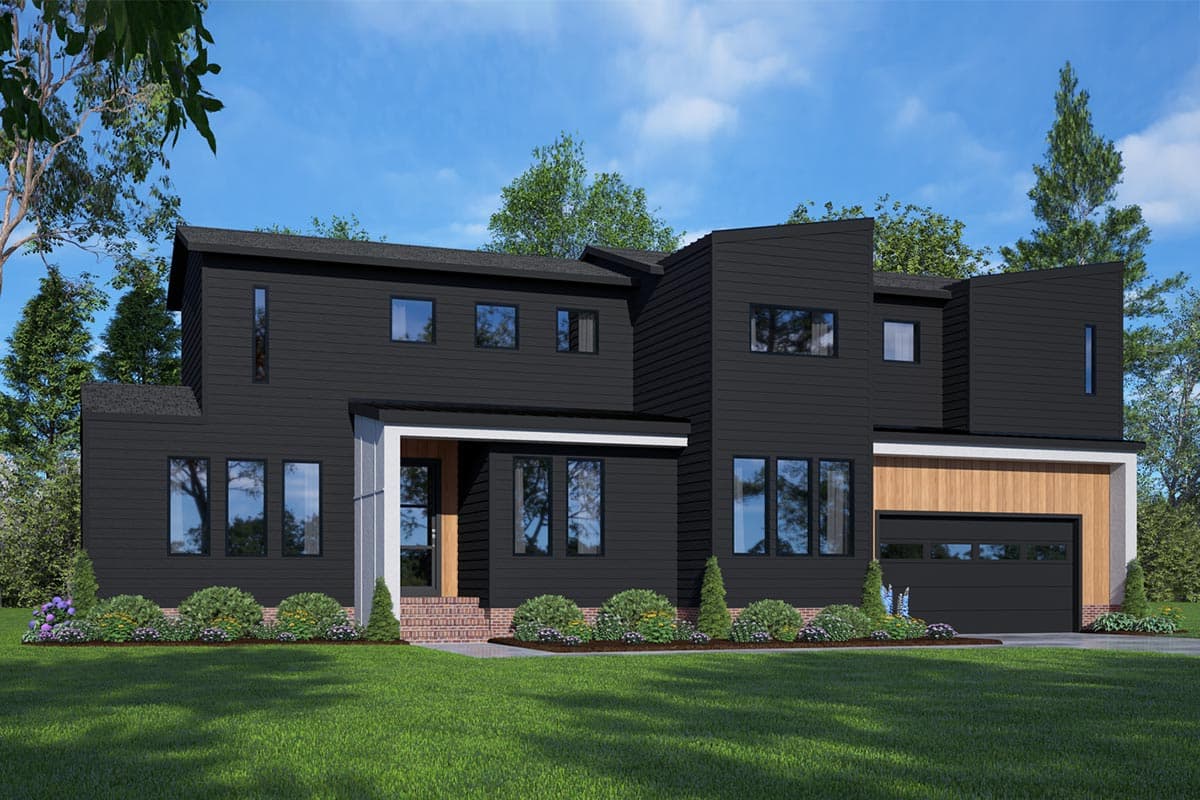 A modern two-story home with dark gray siding, featuring a covered entryway, large windows, and a garage. Landscaping and green lawn in front.