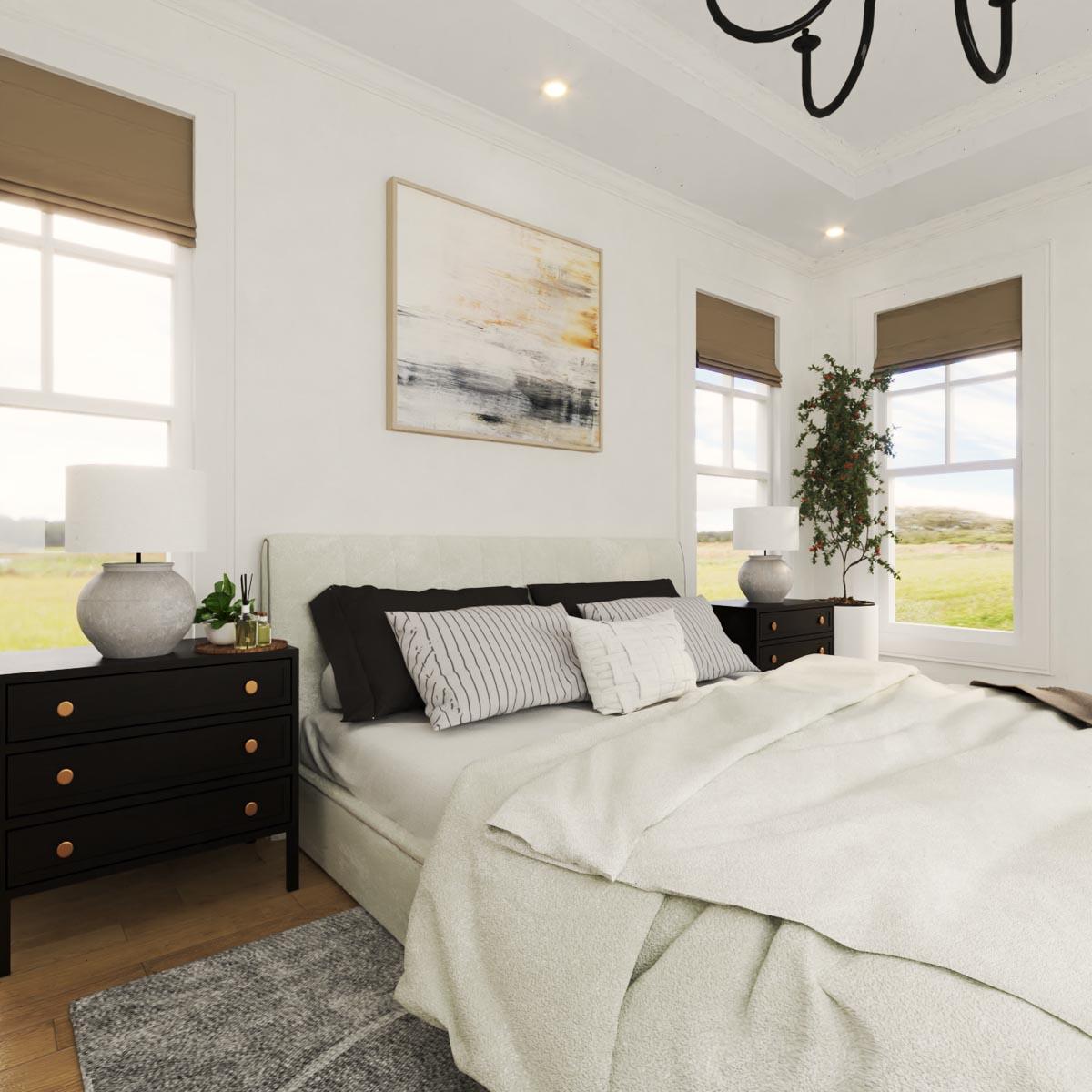Primary bedroom with king bed, two nightstands, and large windows with landscape views.