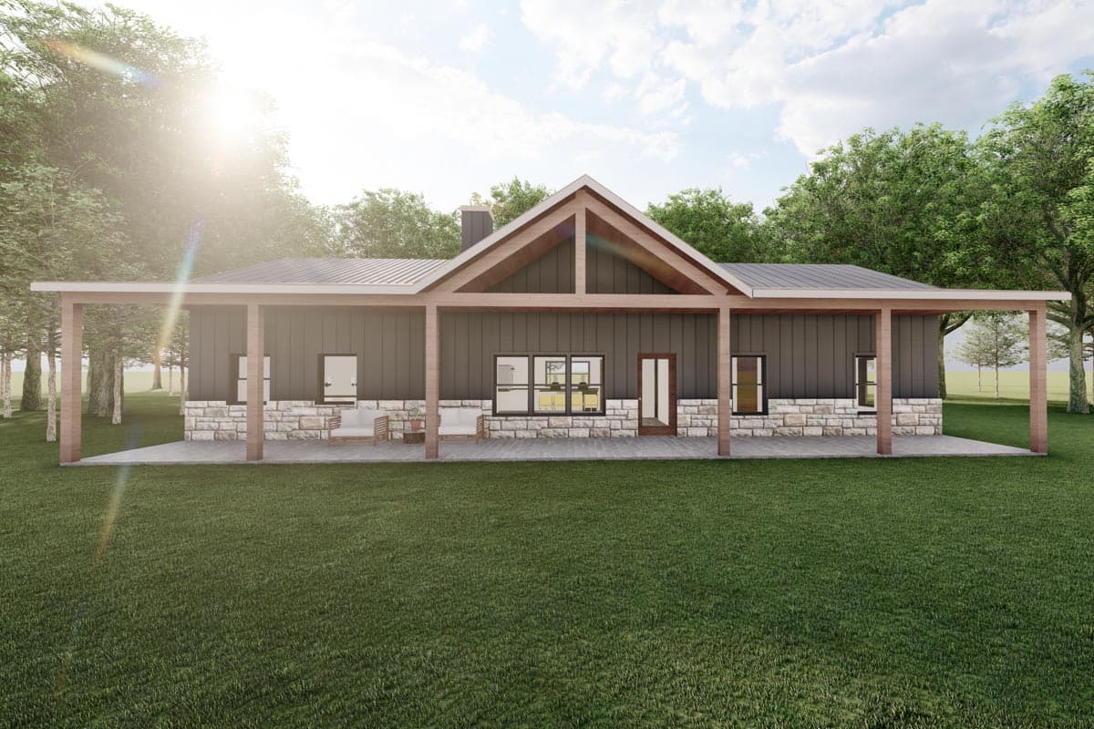 House plan exterior with gable roof, stone foundation, and wide covered porch supported by wooden posts.