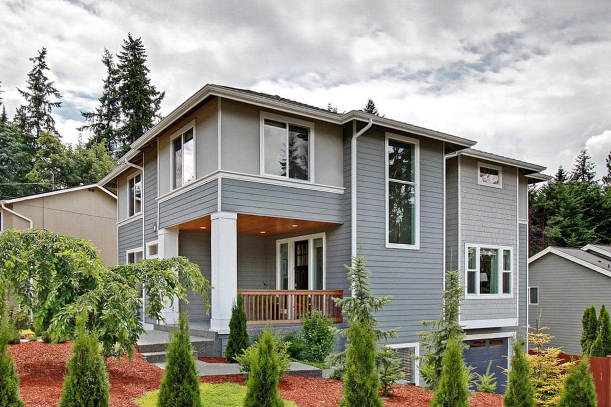 Two-story modern house plan exterior with covered porch, gables, large windows, and attached garage.