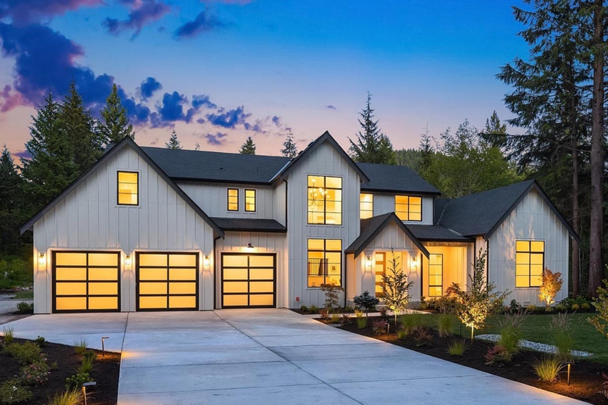 Modern Farmhouse house plan exterior, two stories, with triple garage, gables, and large windows.