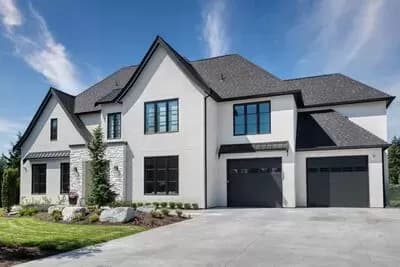 Contemporary French Country Plan with Two-Story Great Room and Outdoor Fireplace