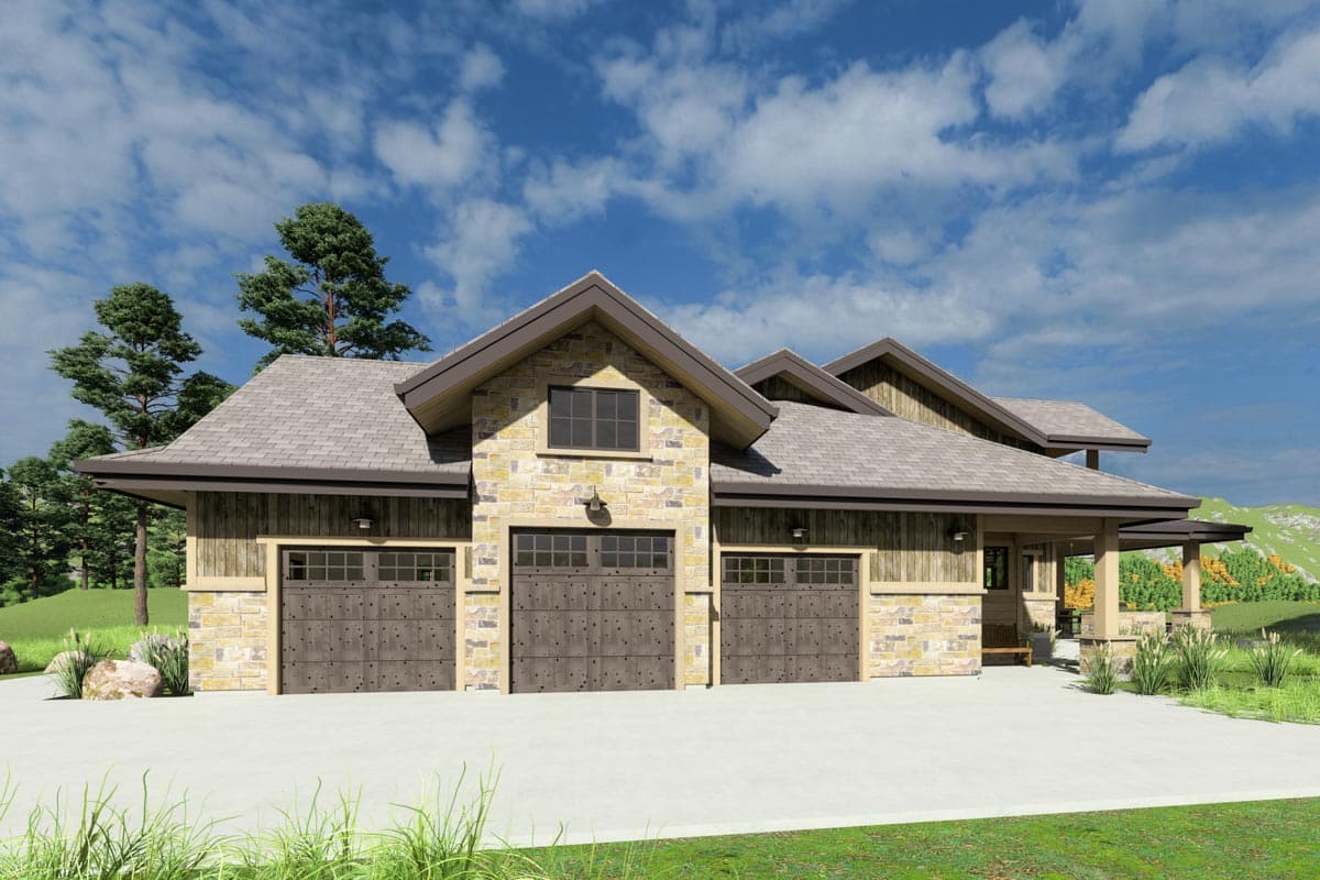 A modern home with three garage doors. It features stone and wooden siding, with a porch and mountain view in the distance.