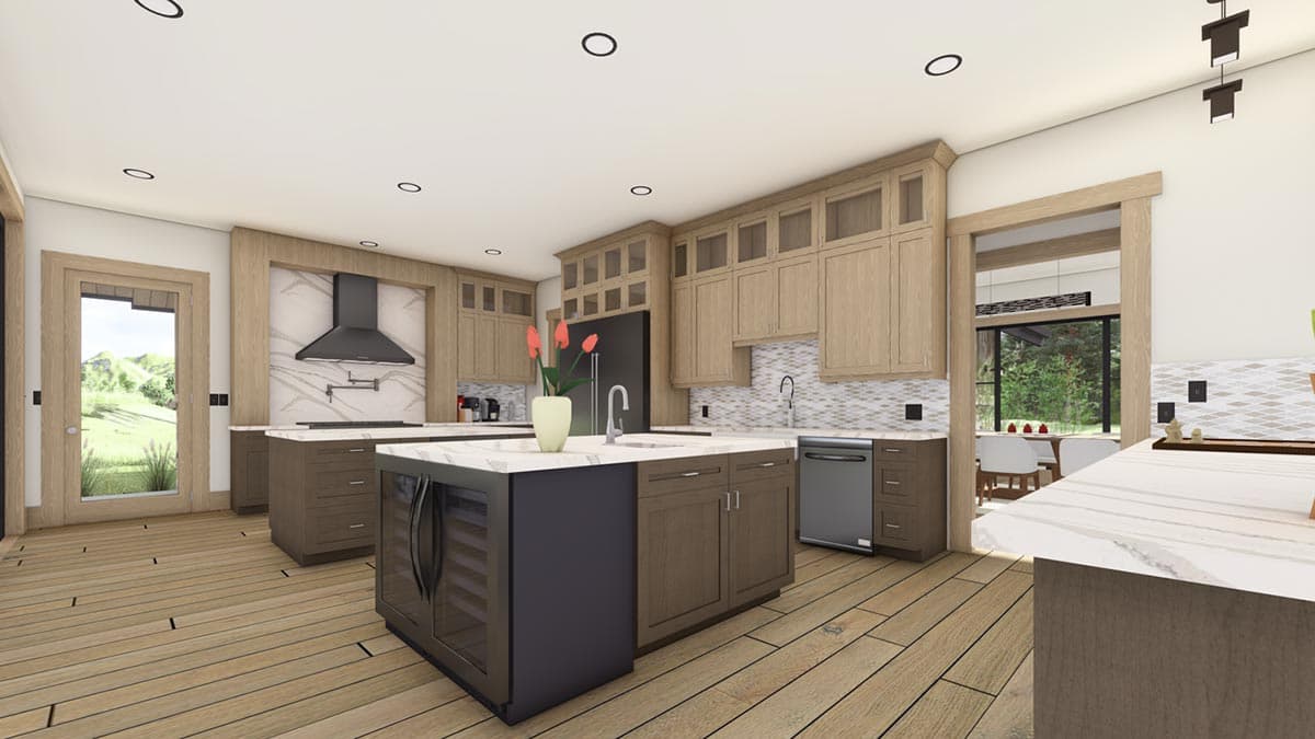 Spacious modern kitchen with two islands, light wood cabinets, and large windows leading to an outdoor dining area.