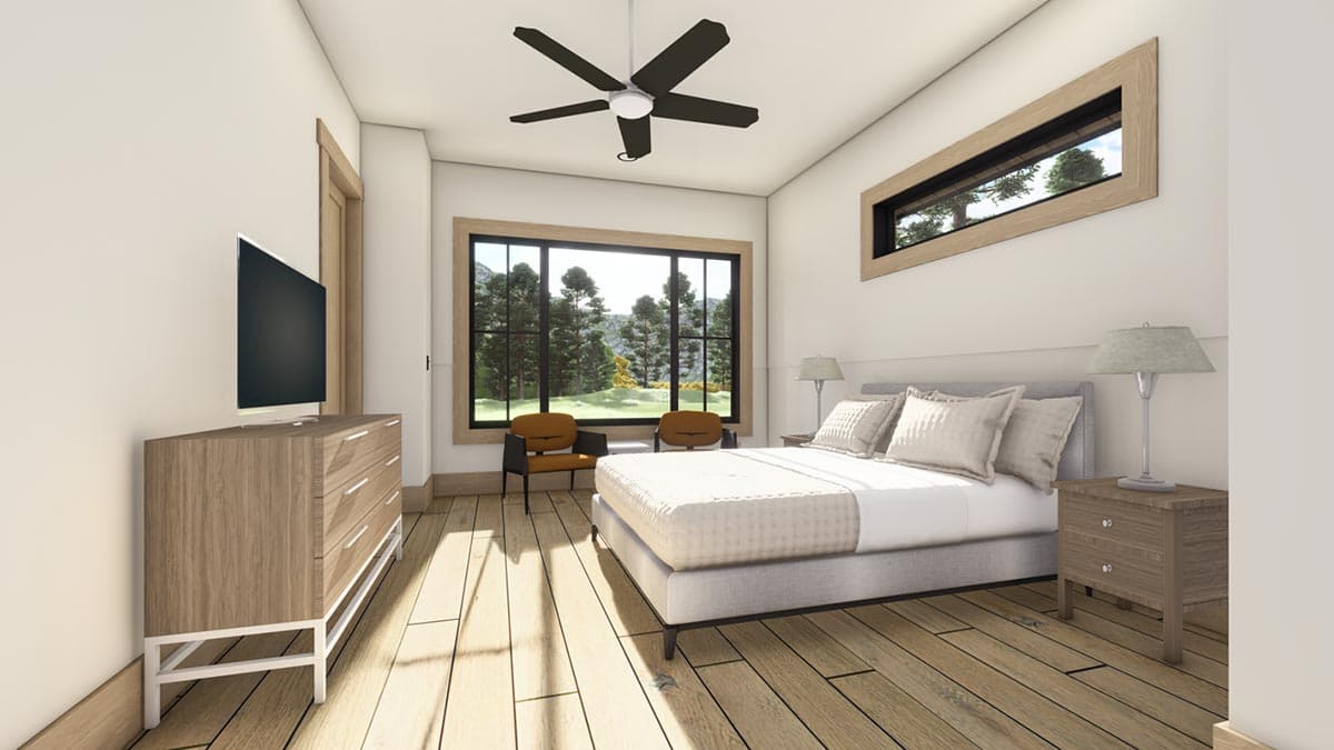 A modern bedroom with a large window framing a scenic view. It has a bed, dresser, wooden floors, and a ceiling fan.