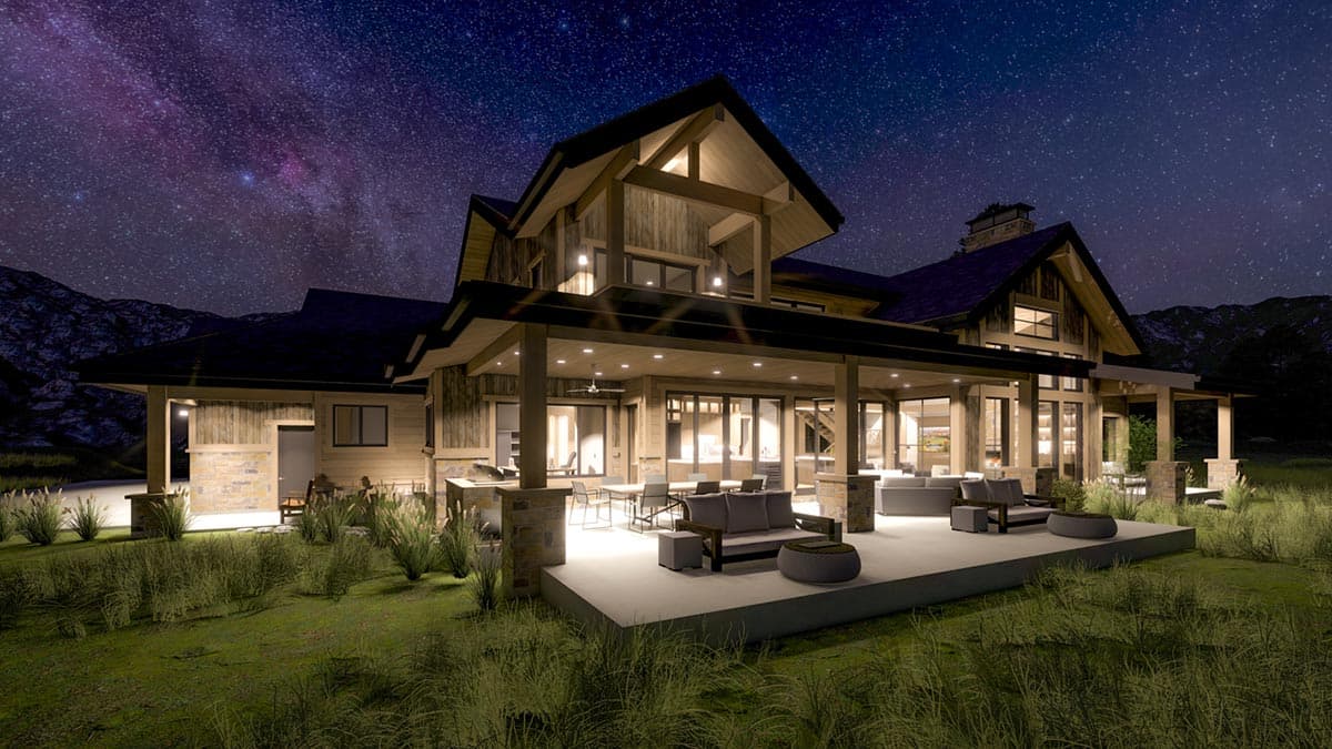 A large, modern home with open-air porch illuminated at night under a starry sky. Outdoor seating and landscaping visible.