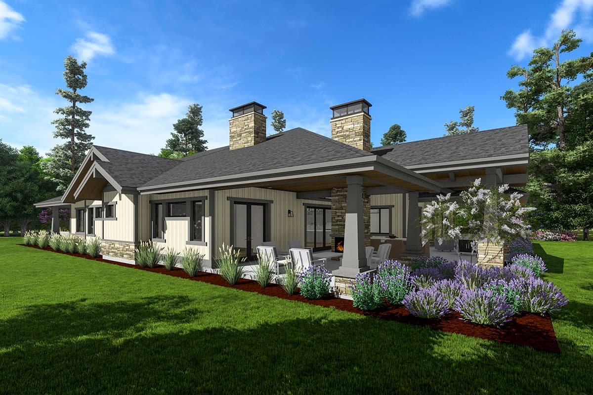 Craftsman style house plan exterior with stone chimney, covered patio with outdoor fireplace, and multiple gables.