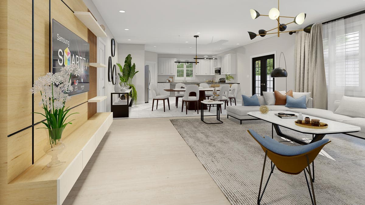 Open concept living space featuring a modern media wall, dining area with a round table, and a sectional sofa in a living room.