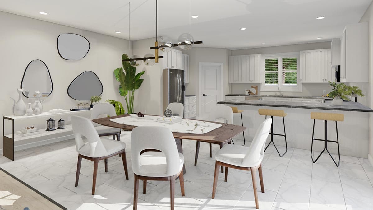Dining area and kitchen with white cabinets, island, and breakfast bar. Geometric mirrors and plant decor on wall.