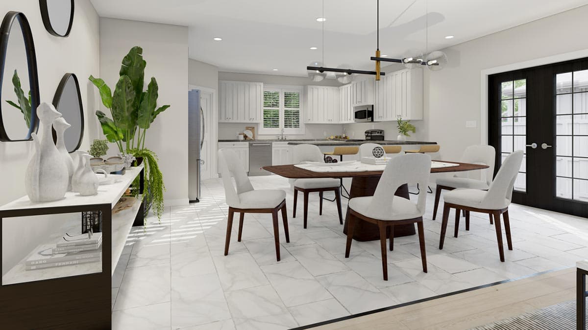 Dining area and kitchen with white cabinets, island seating, wooden dining table, and French doors.