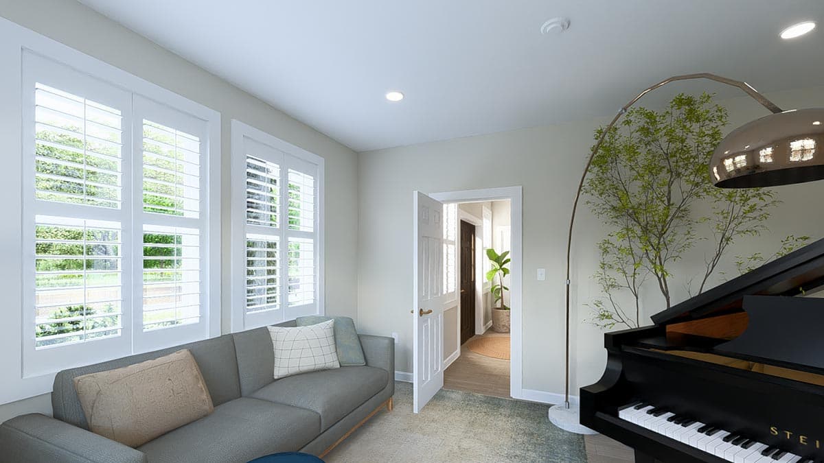 Interior view of a room with plantation shutters, a sofa, and a grand piano. An open doorway reveals a hallway.