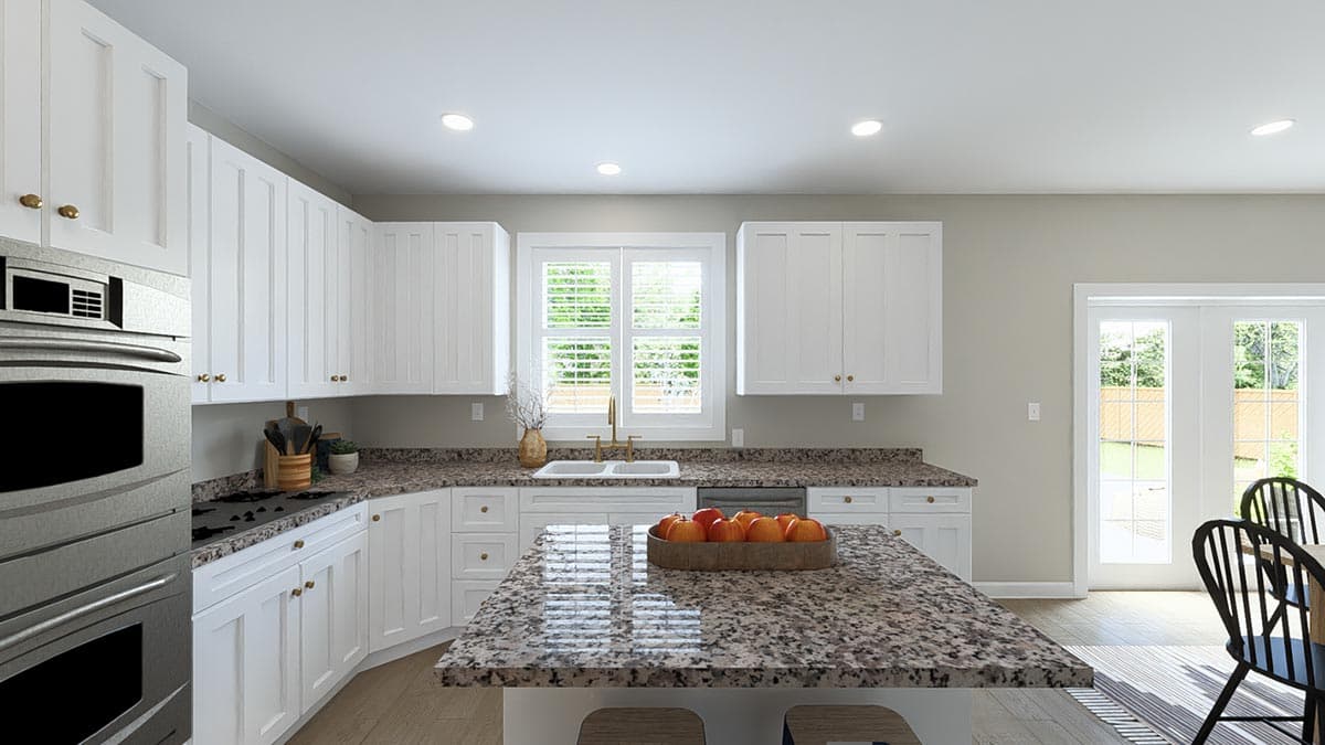 Kitchen with white cabinetry, granite countertops, island, double oven, and double doors to backyard.